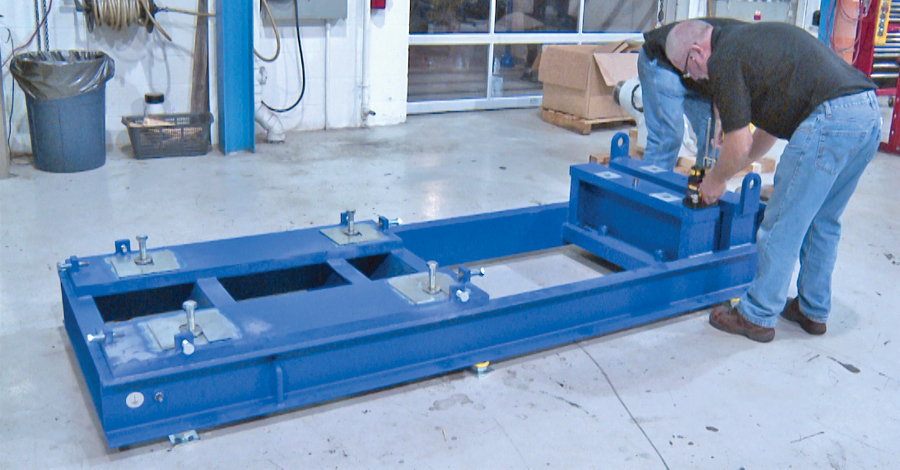 Photo: Benchmark Maintenance Services. Measuring for flatness on a two-level steel bed.